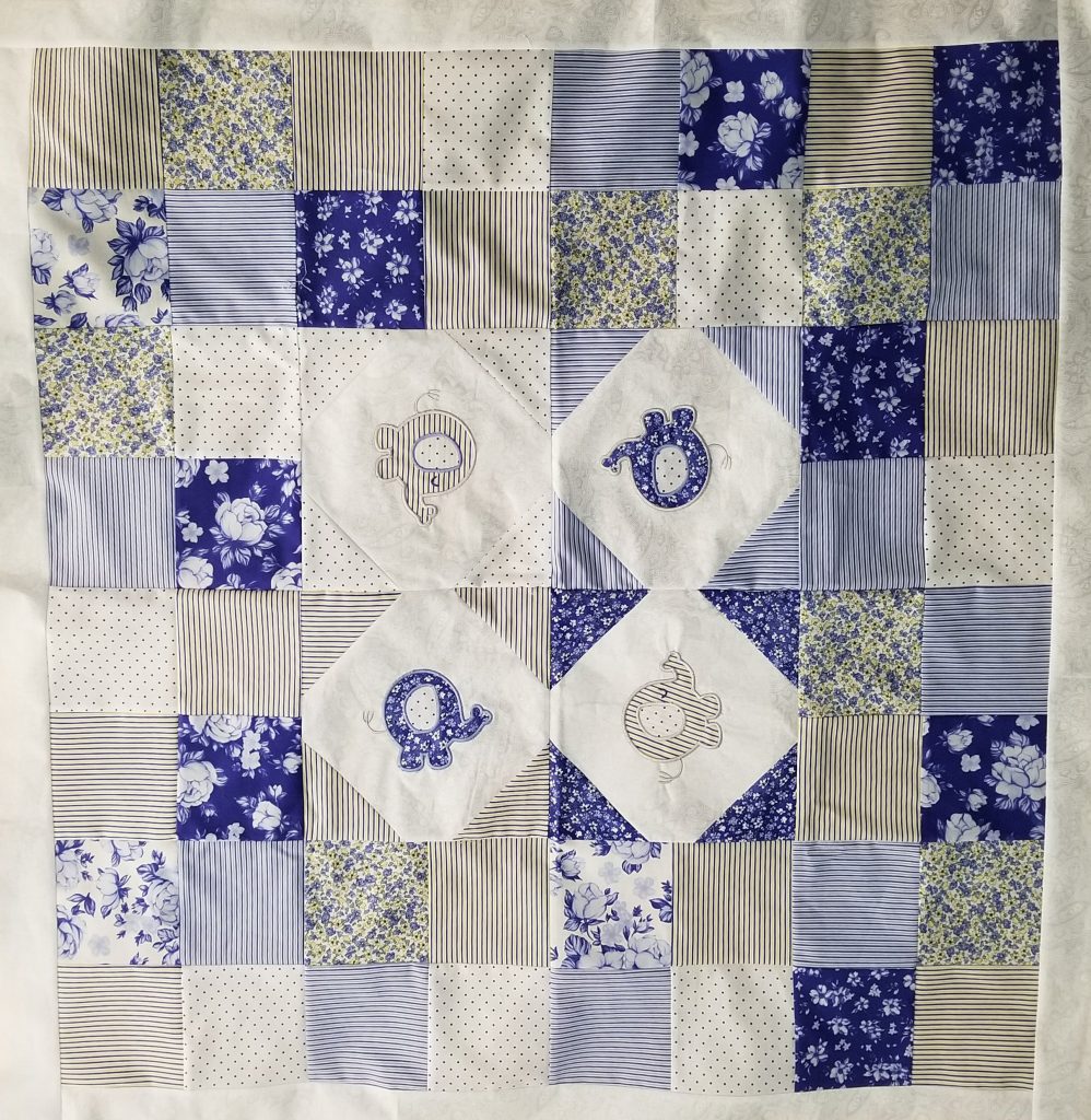 Liz H. did her first baby quilt for Project Linus in memory of a dear friend who sewed many quilts for the babies. Also first thing sewed on my new wonderful awesome fantastic Janome 15000 sewing machine.